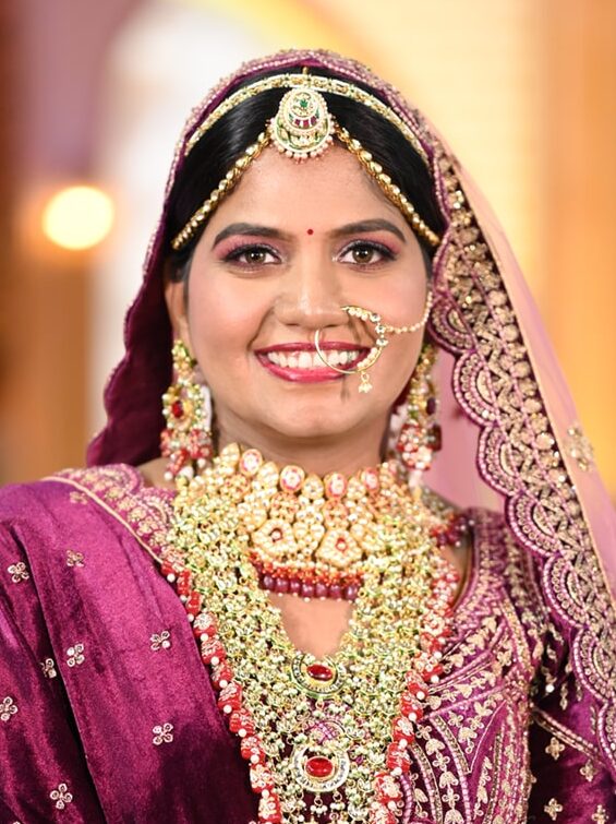 A North Indian bride with a traditional makeup look for dusky skin on her wedding day.